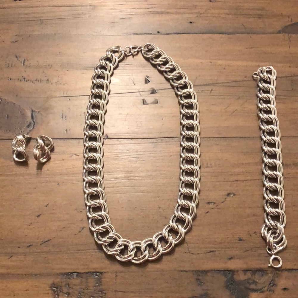 Silver 3 piece chain necklace, bracelet, and earrings.